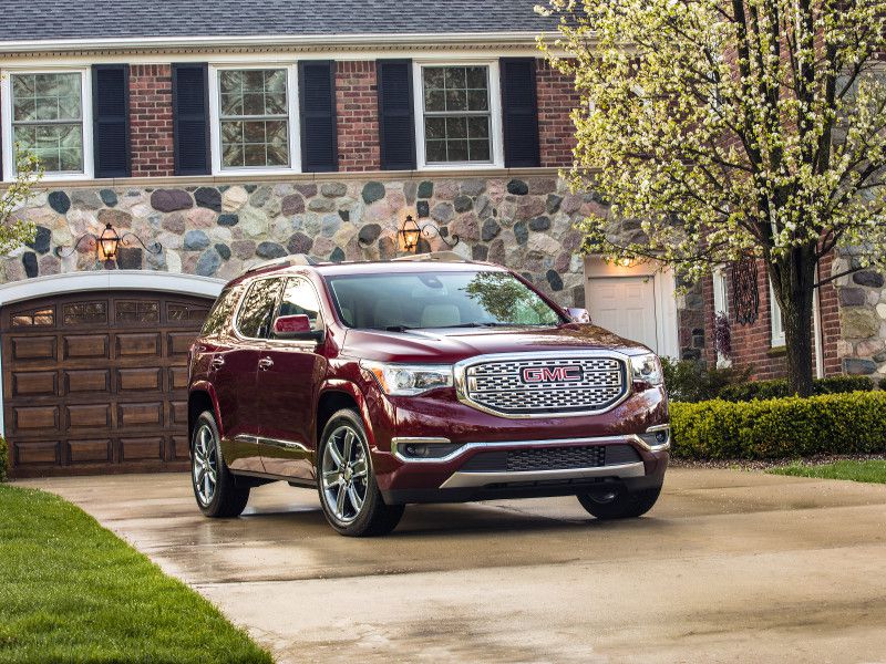 2018 GMC Acadia Denali red parked ・  Photo by GMC