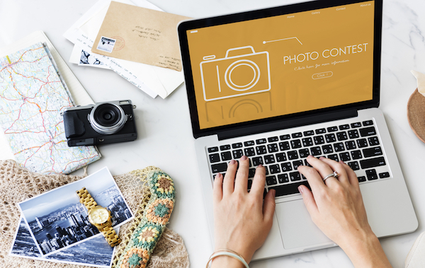 laptop with photo contest for social media small business
