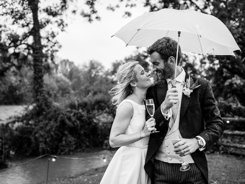 Sophie Millington and her husband at their barn wedding day in the Cotswolds