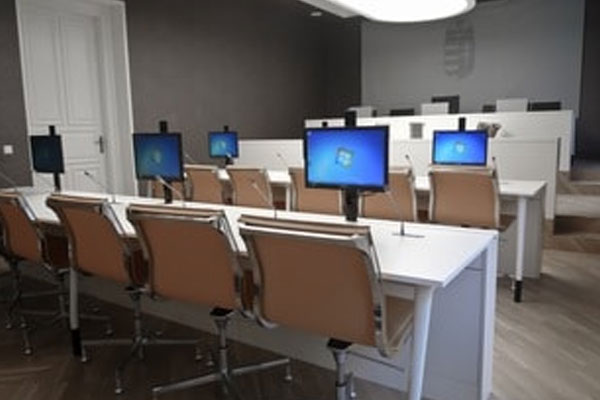 view of competition council chamber with various computers installed with the monitors mounted on DBLIFT-0019 screen lifts