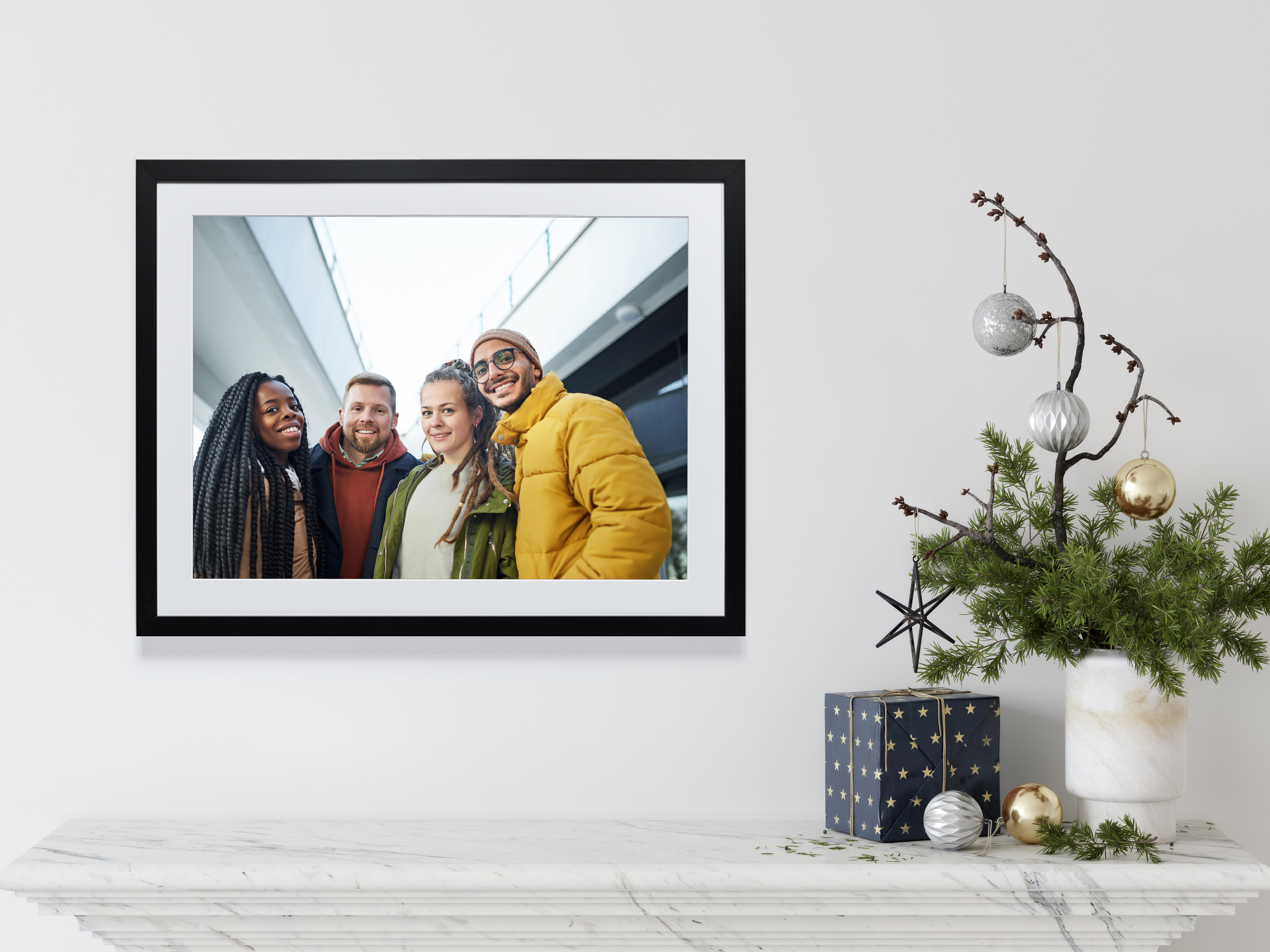 Framed print on mantel of friends