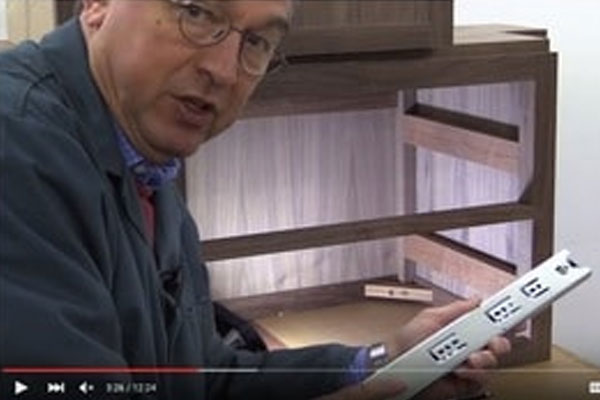 screenshot of a instructive video on how easy push-to-open drawer slides are to install.