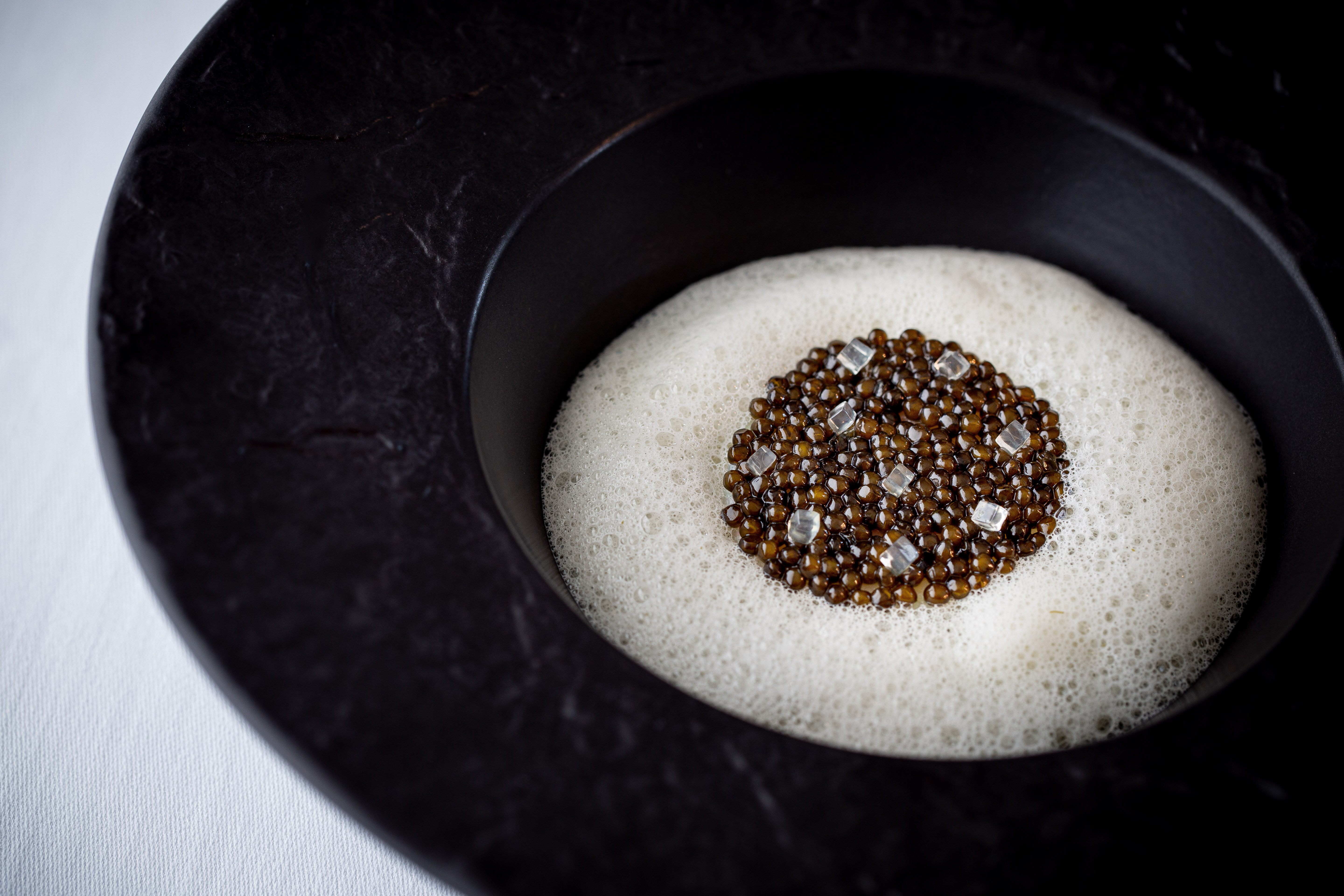 Cornish cod cooled by N25 Schrenckii caviar, crab, Champagne sauce; Credit: Jamie Scott-Long