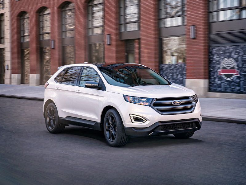 2018 Ford Edge White Driving Front Quarter ・  Photo by Ford 