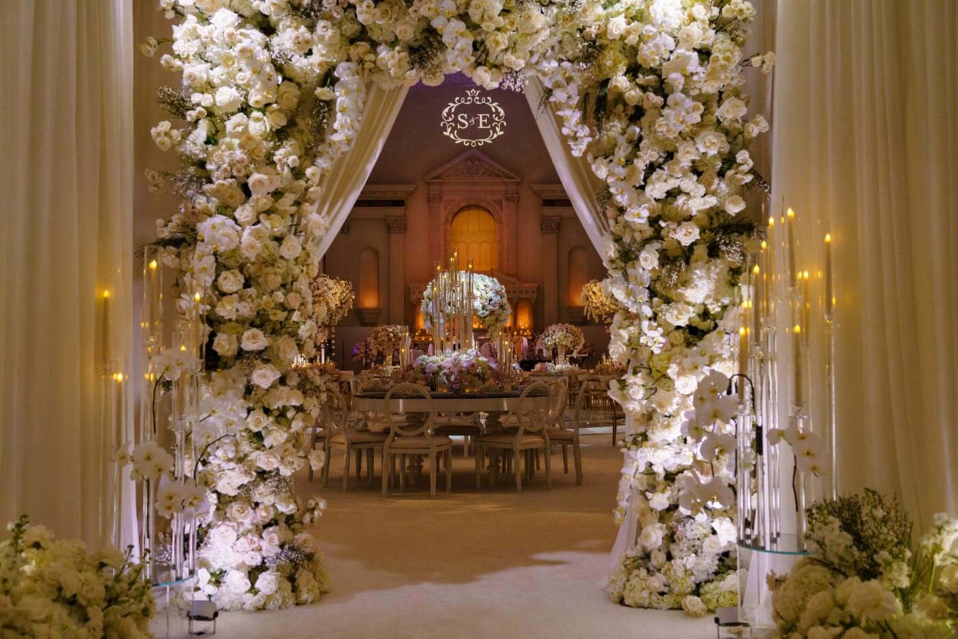 view of floral decorated entry way into party