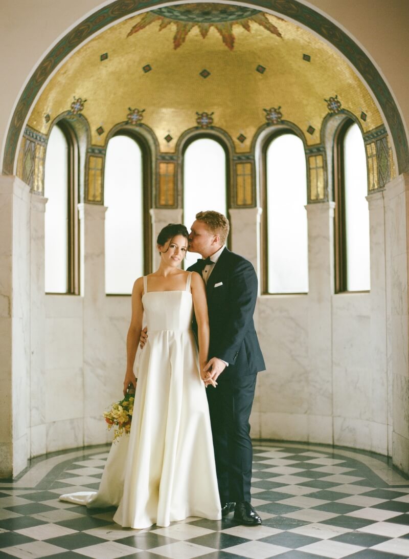 bride and groom embrace