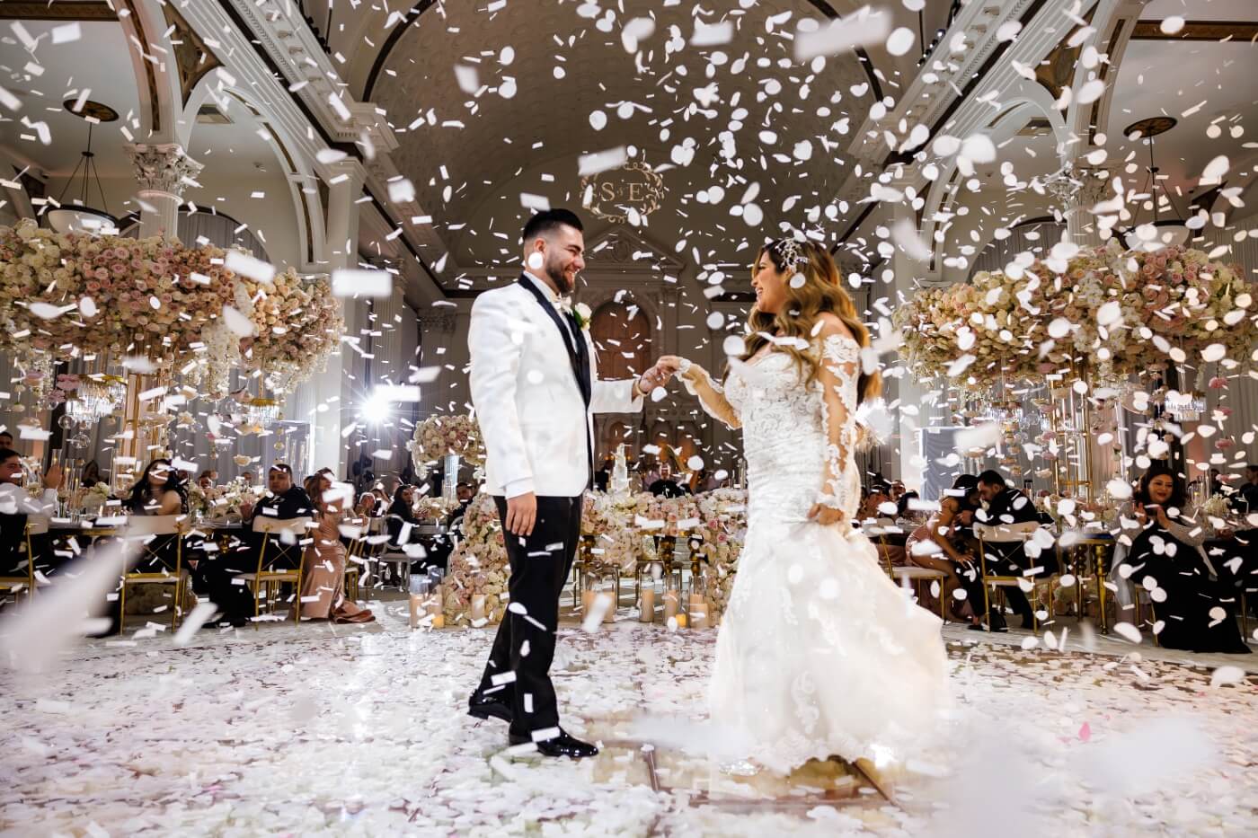 bride and groom on the dance floor amidst confetti