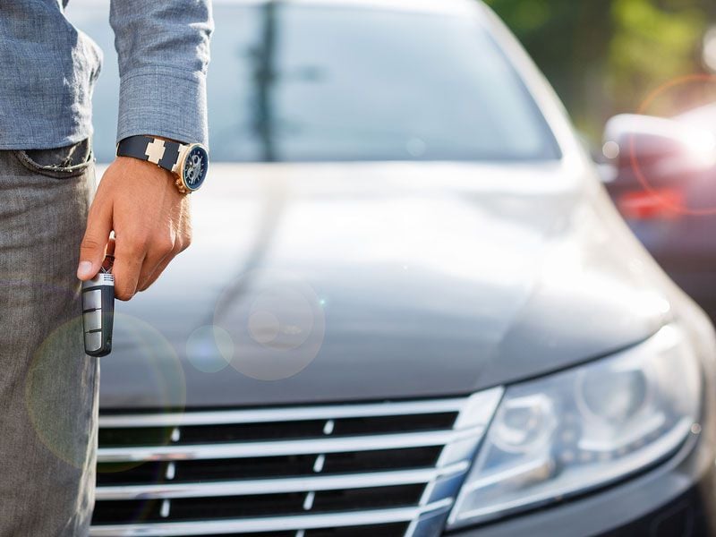 bigstock man in front of car with key 