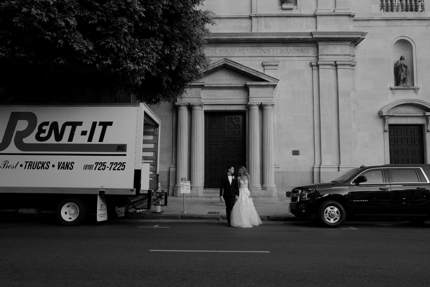 couple outside vibiana with cars