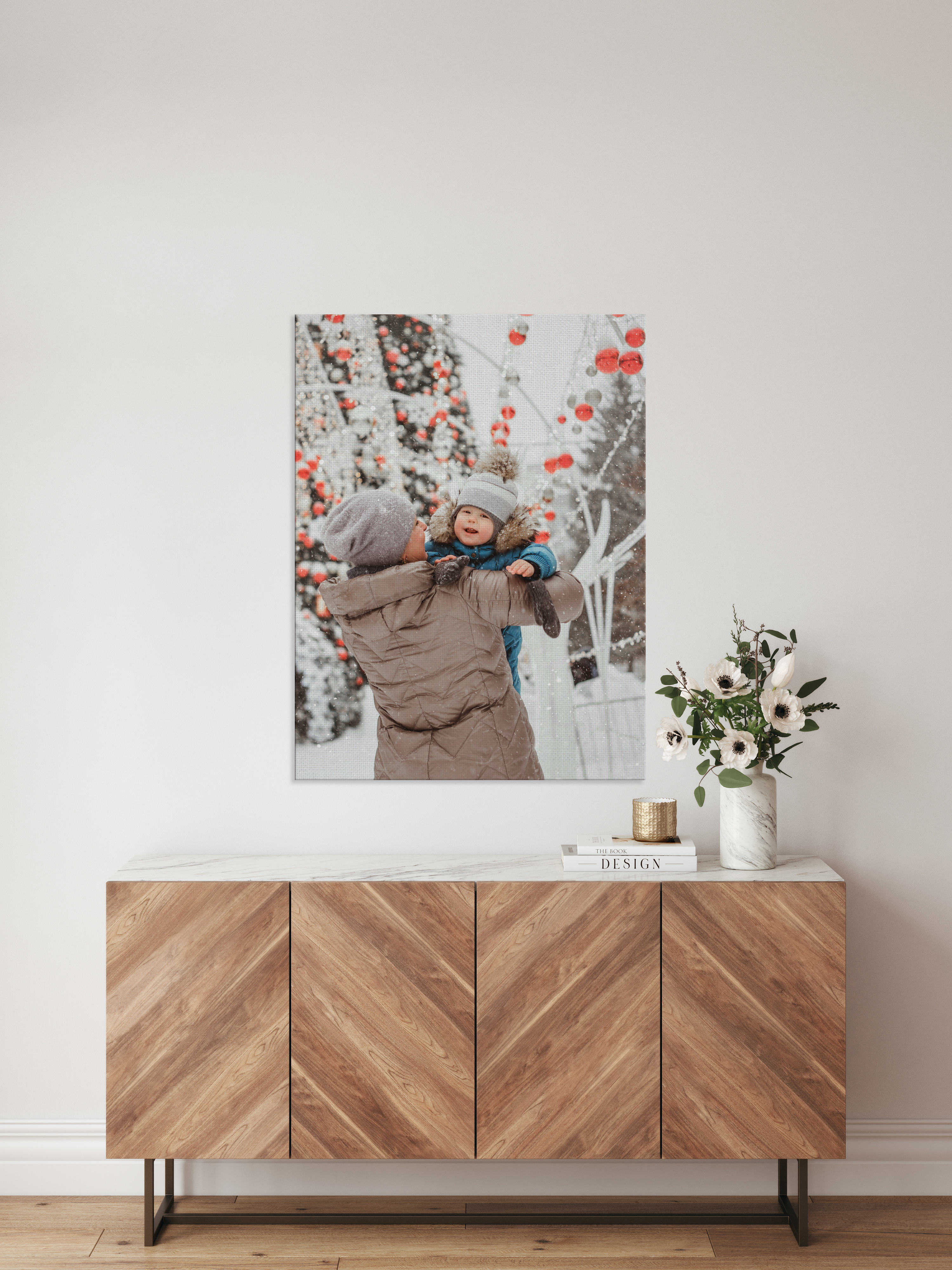 Canvas print over cabinet of mother and son in the snow