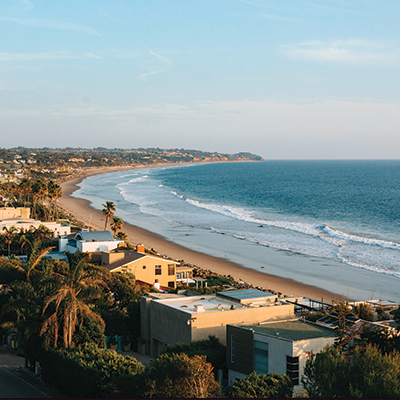 A picture of the edge of coastal town at sunset