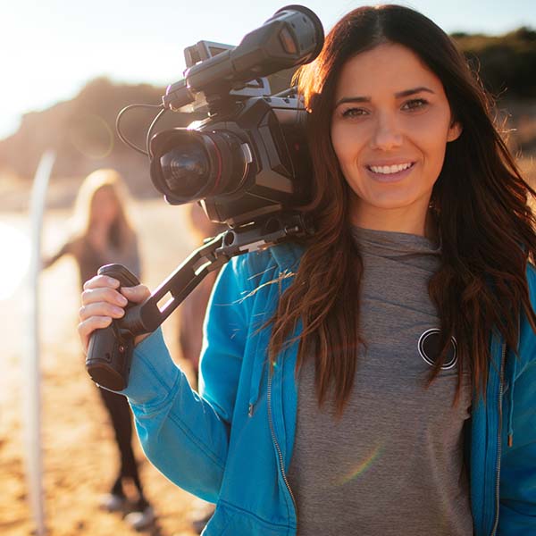 Camerawoman on beach location
