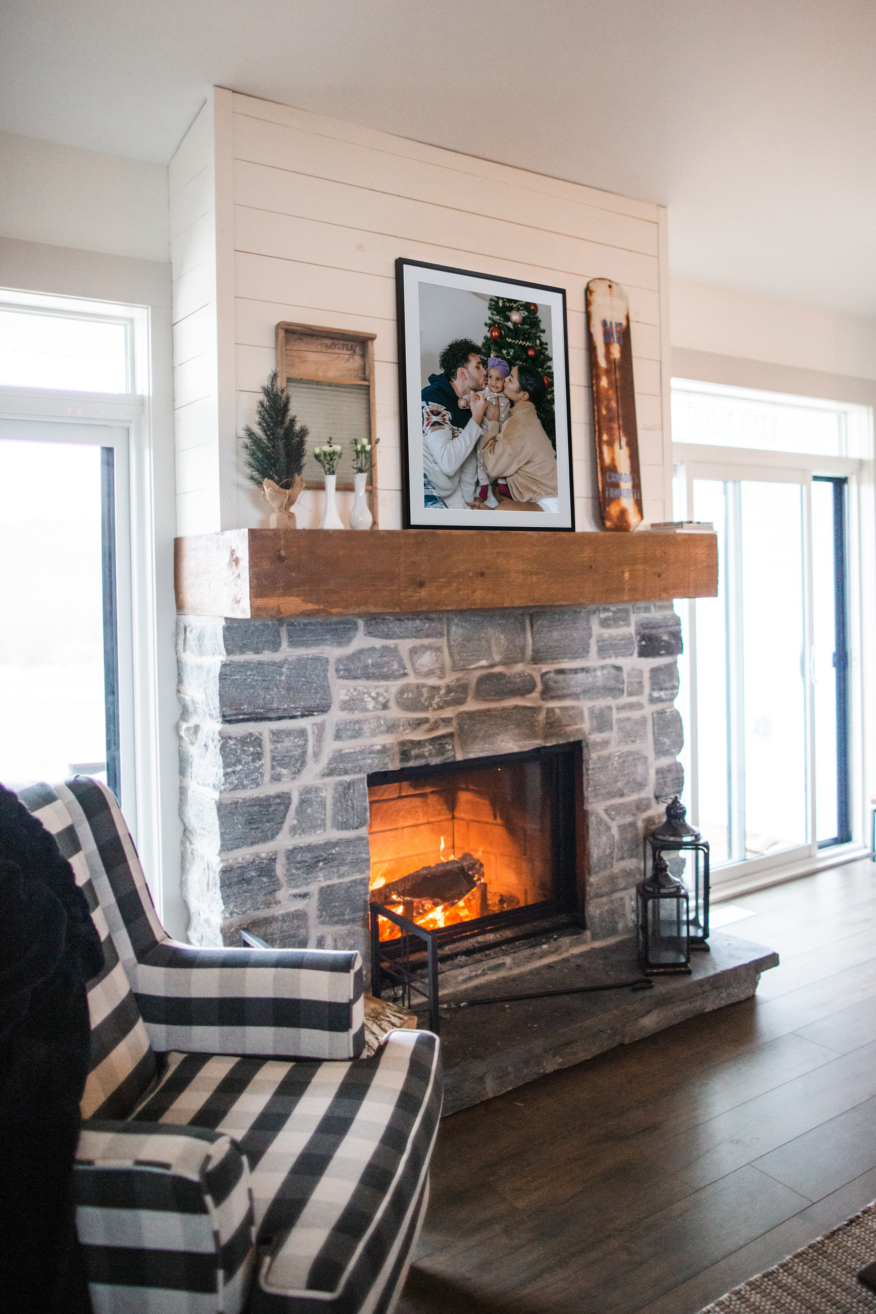 Framed family portrait on top of fireplace