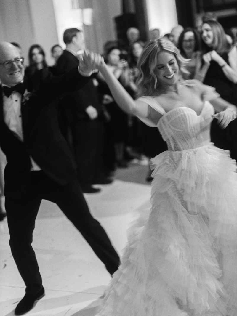 a bride dances with her father at her wedding reception in a cathedral in downtown Los Angeles