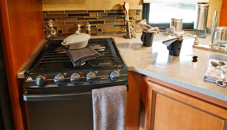 Most RVs come equipped with a three-burner stove.