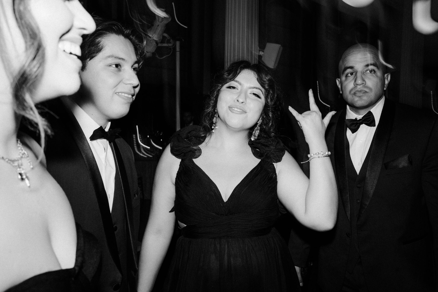 a wedding guest on the dance floor posing for the camera