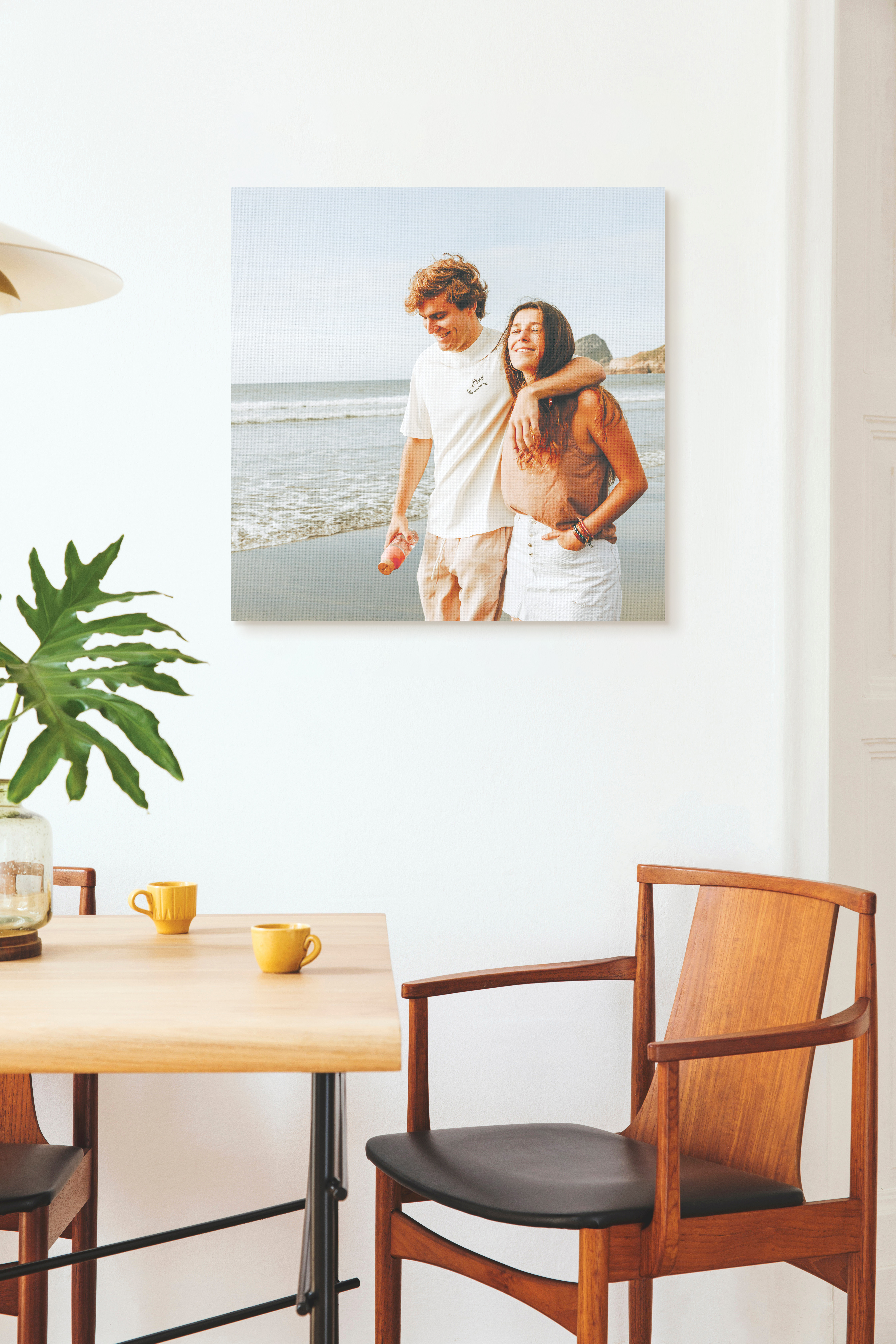 Canvas print of couple at beach in dining room
