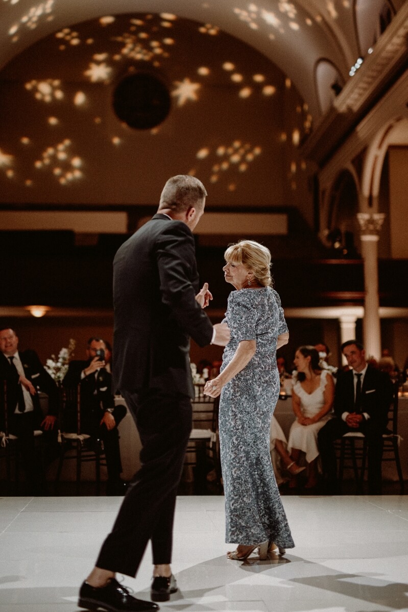 groom dancing with mother