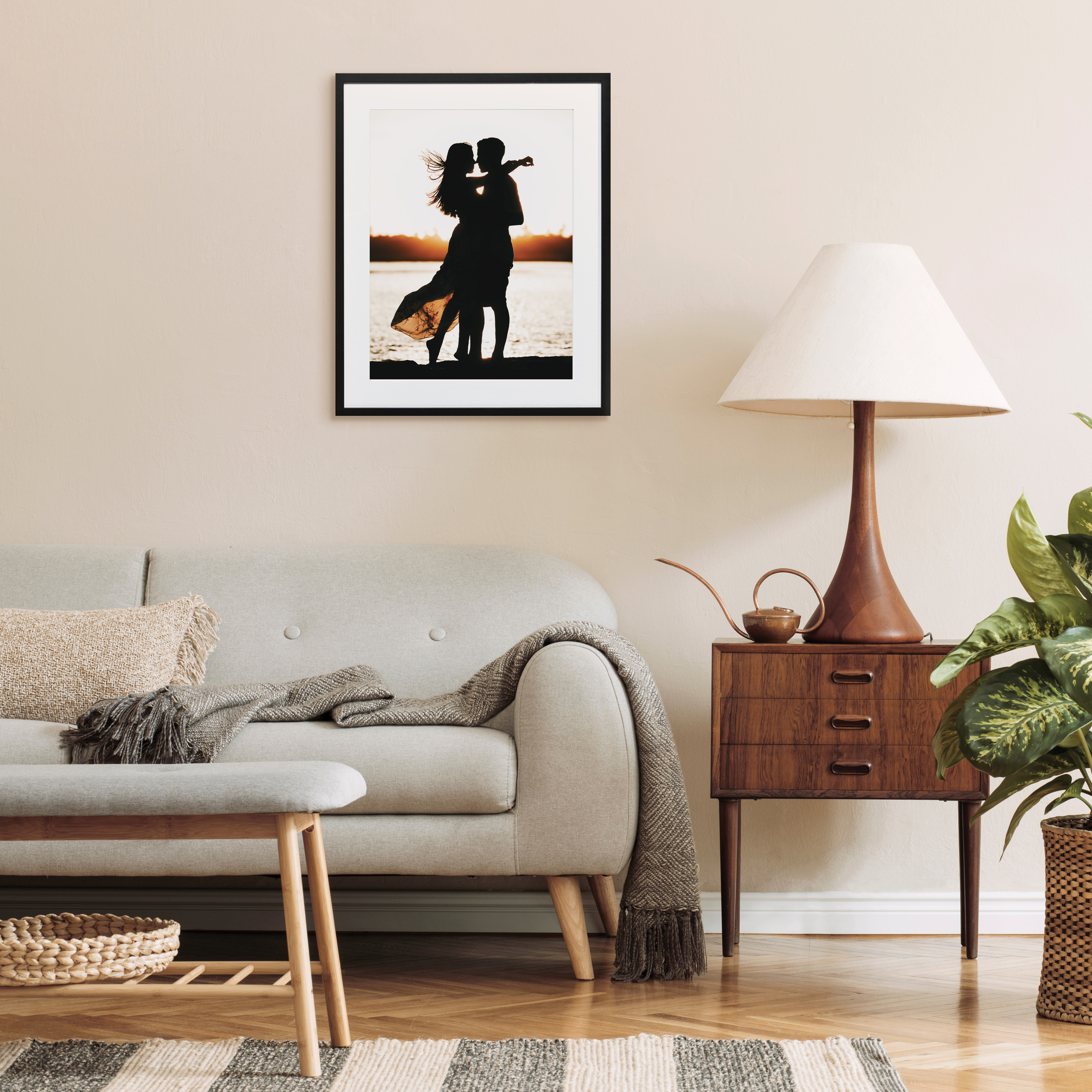 Framed print of couple on beach in living room