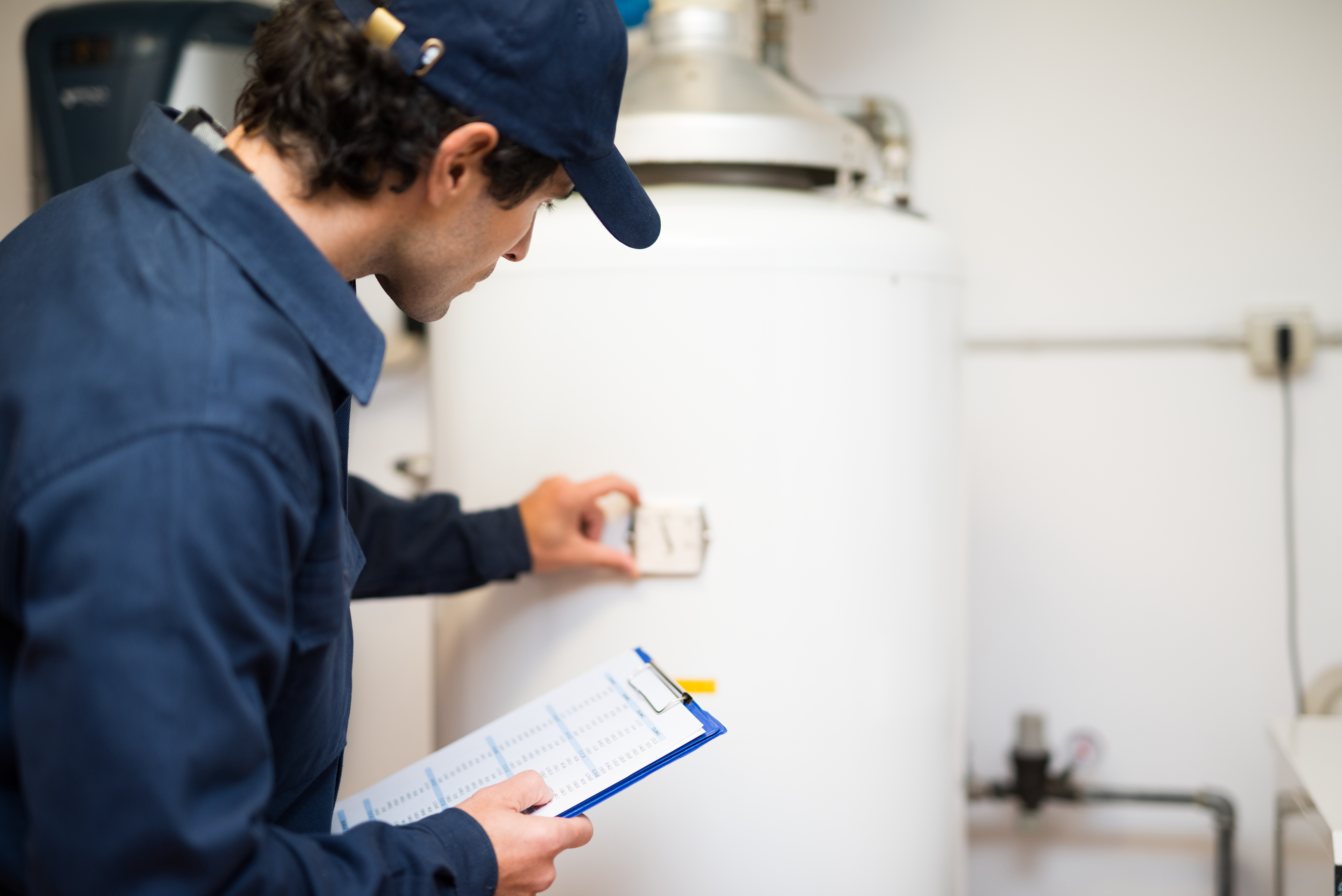 Plumber repairing an hot-water heater