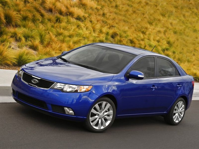 2012 Kia Forte blue driving ・  Photo by Kia 