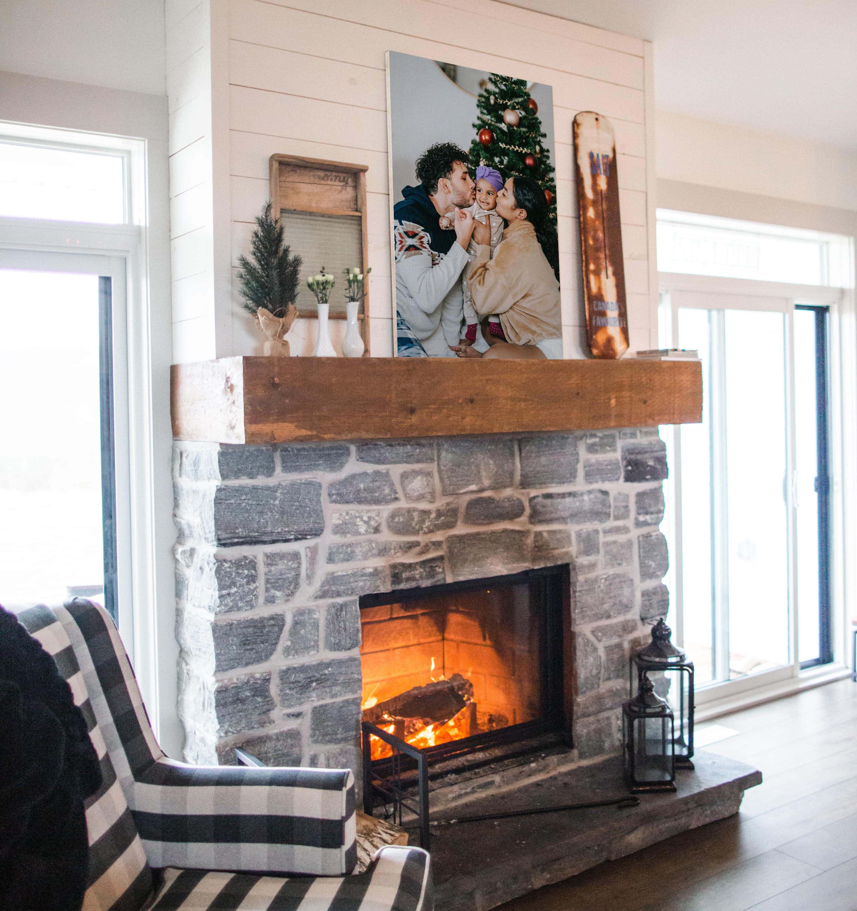 Canvas print on top of fireplace mantel of family Christmas photo.