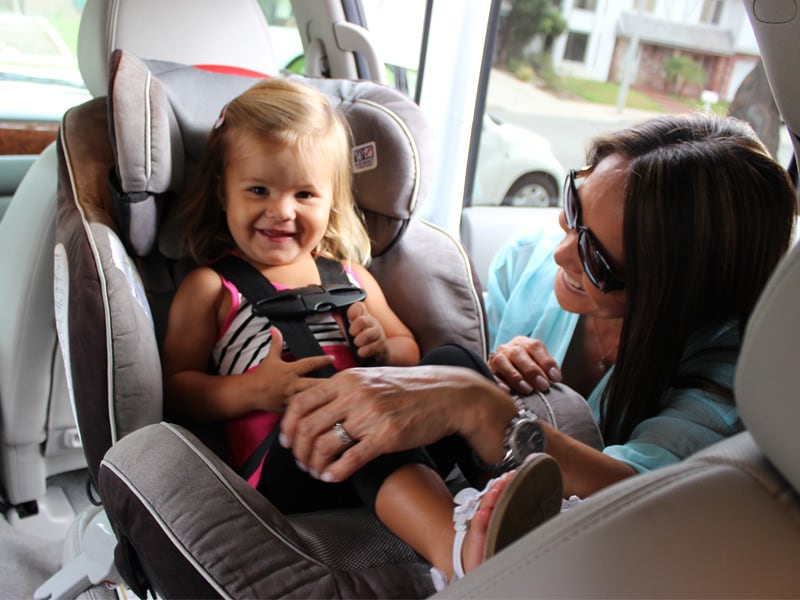 Happy Baby in Car Seat with Mom 