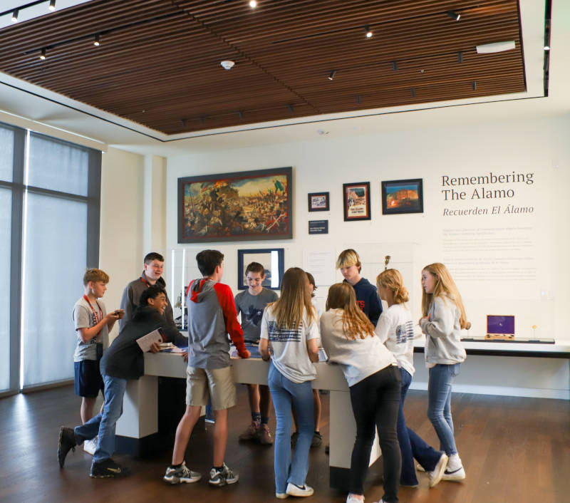Students at an interactive exhibit at The Alamo.