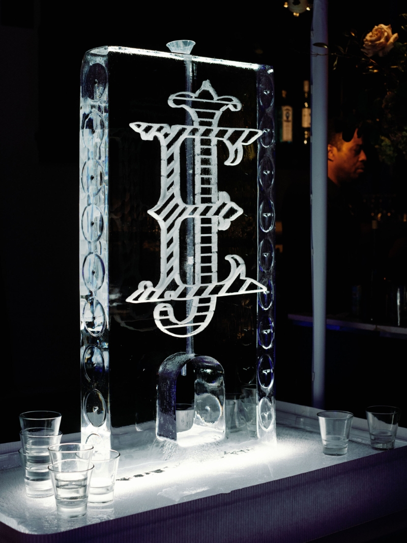 an ice sculpture with the initials 'EJ' at a DTLA wedding reception