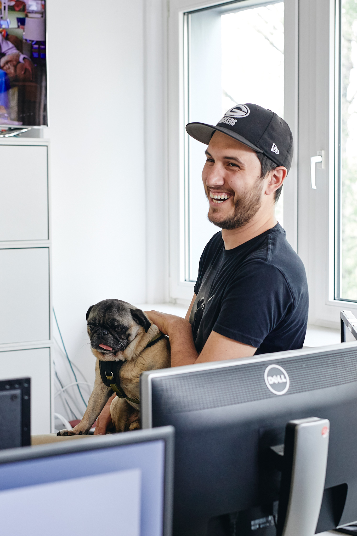 Portrait of employee of broadcasting station with dog