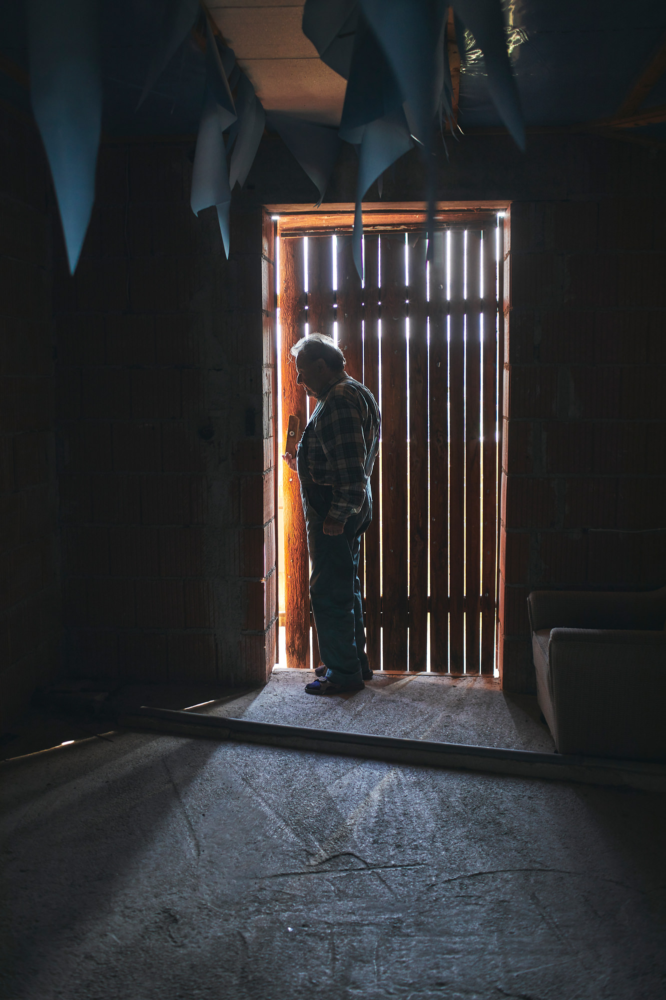 Portrait of owner at construction site in darkness