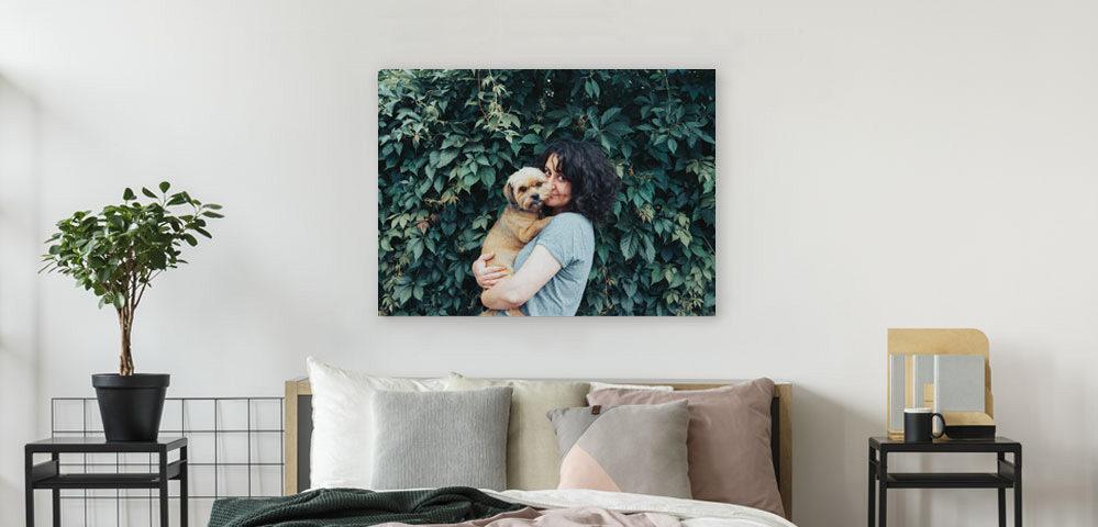 Canvas print of girl with dog in bedroom