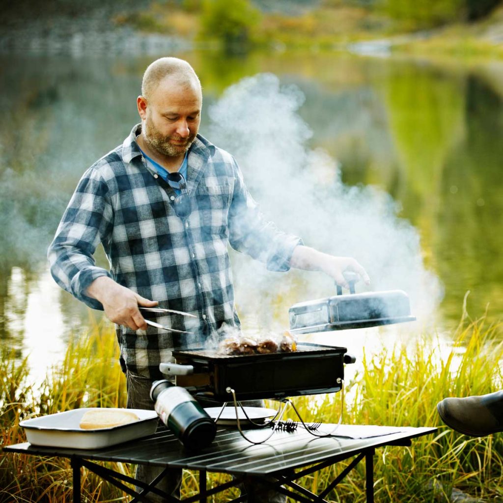 man grilling outside