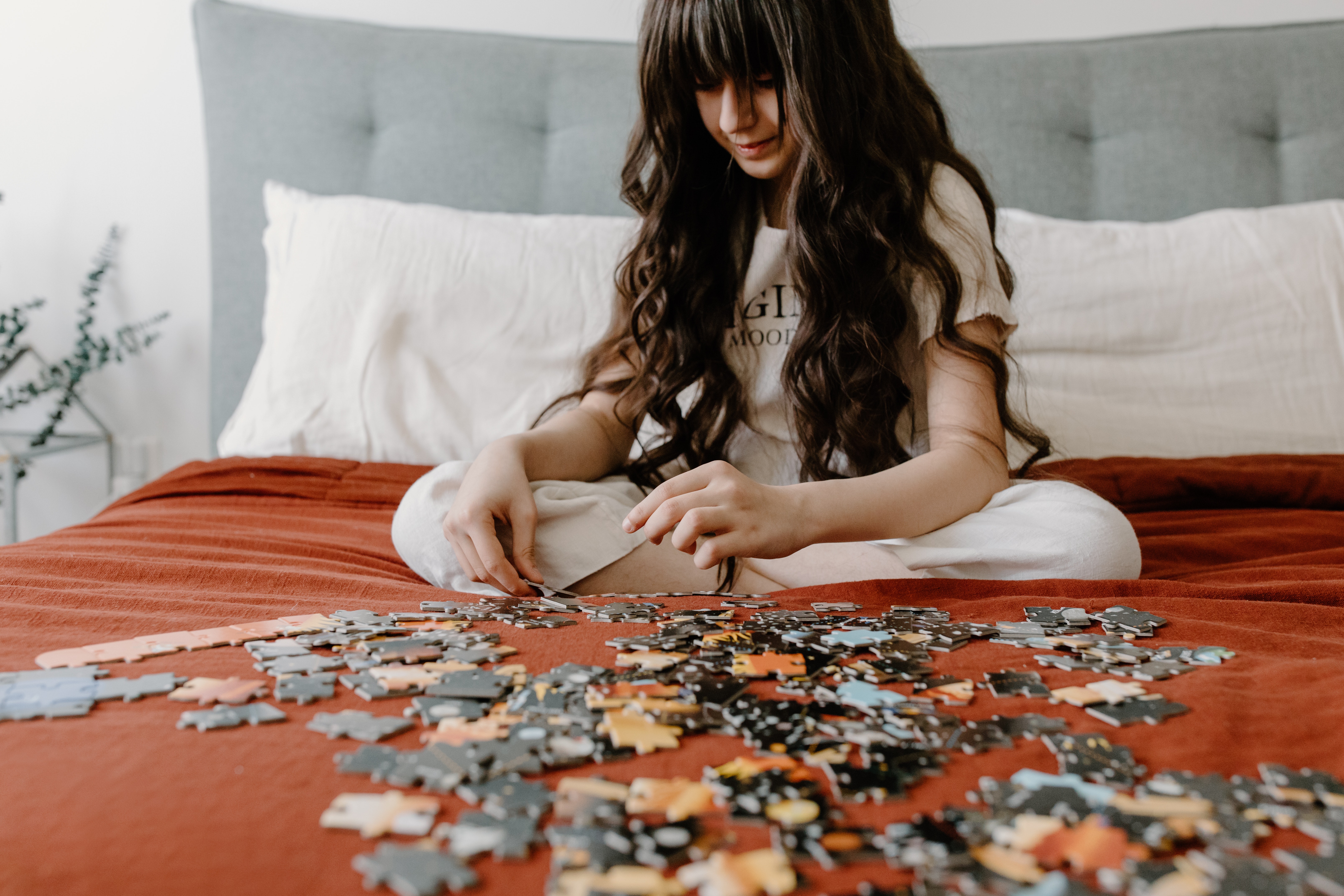 Picture of girl solving a puzzle