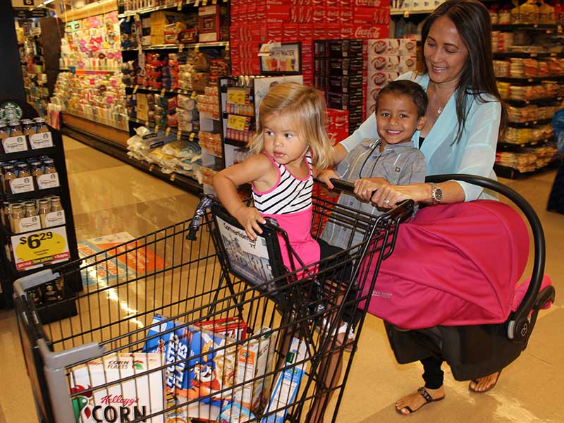 Car seat on outlet top of shopping cart