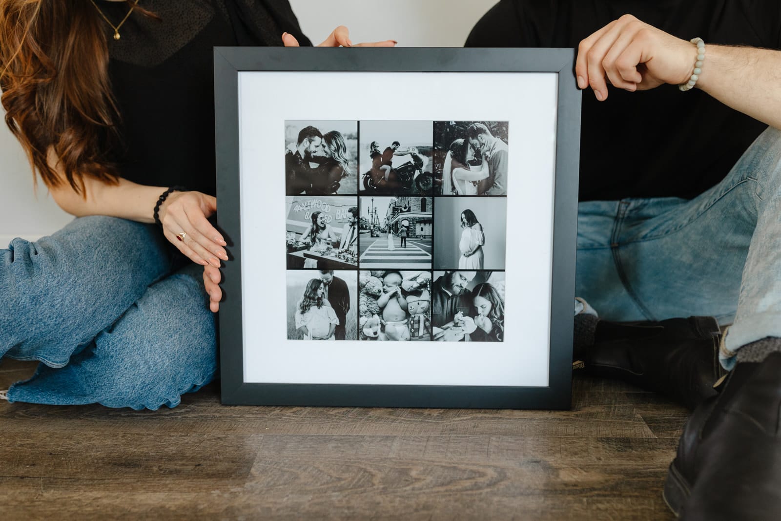 Photo of a couple holding a framed collage print
