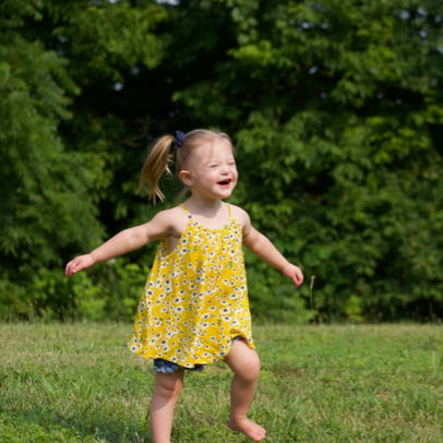 Charlee running in a field