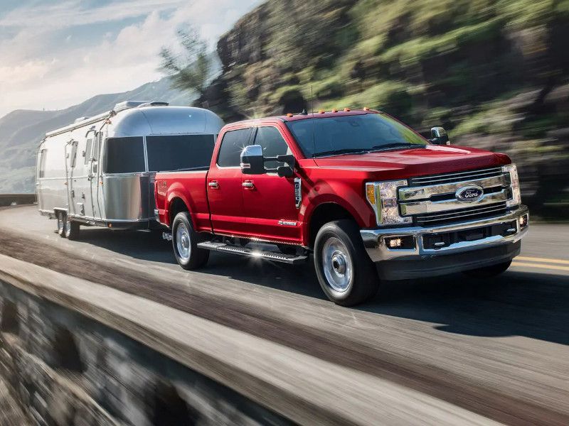 2019 Ford F 250 Lariat red towing ・  Photo by Ford 