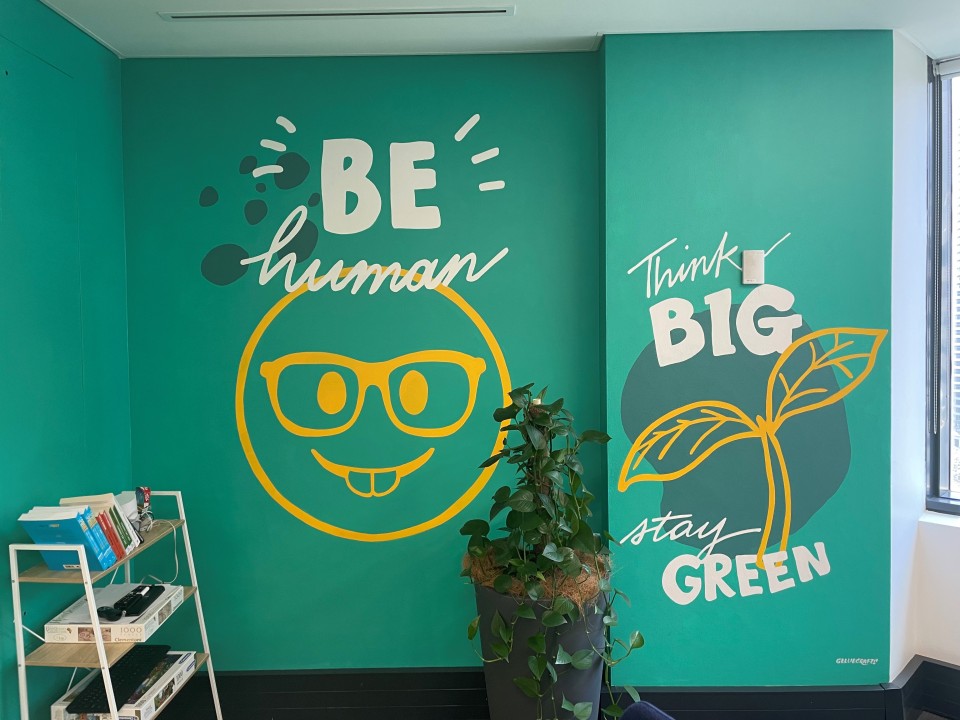 Brighte office with a mural of our values
