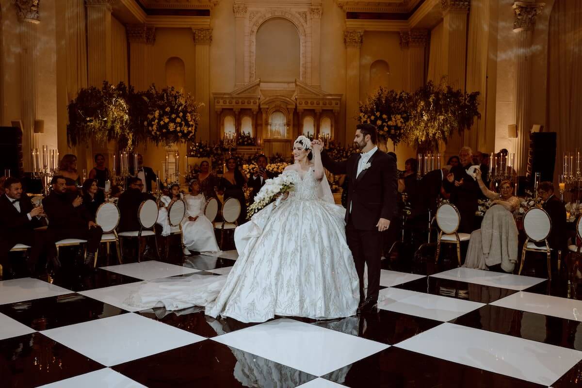 bride and groom on black and white floor