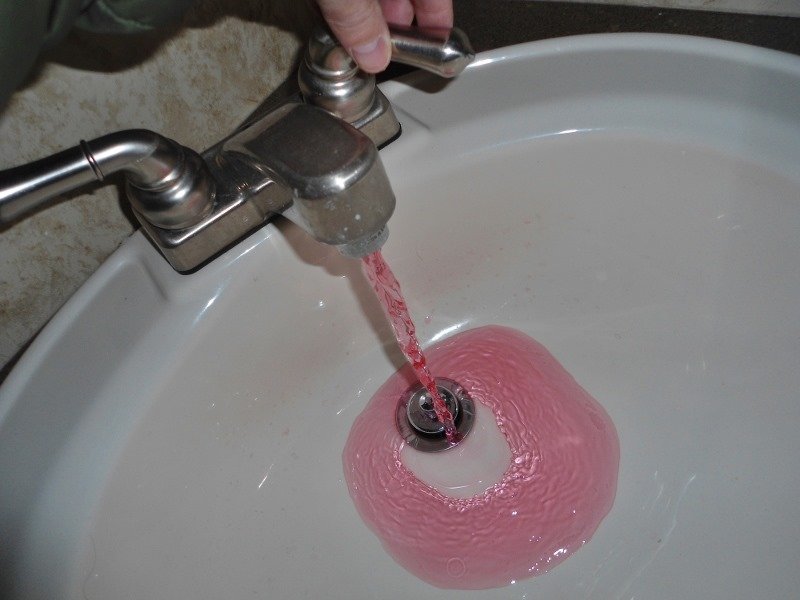 Run your faucets until pink antifreeze starts to pour out.