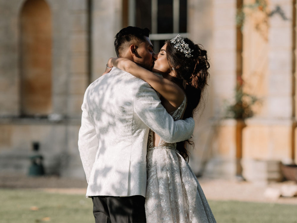 bride and groom kiss at their dreamlike aynhoe park wedding