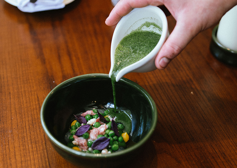 Lovage soup with eel, pea and ham