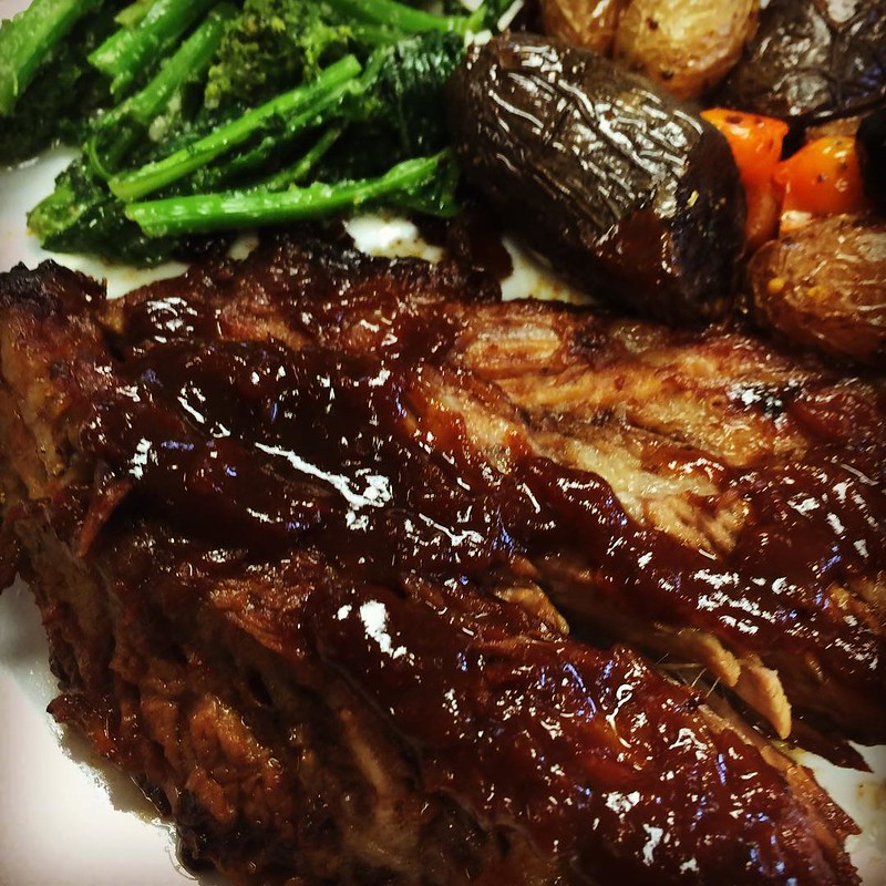 Atlanta Brisket with Broccoli Rabe in garlic sauce and purple roasted fingerlings, orange tomatoes and golden raisins infused with vermouth.