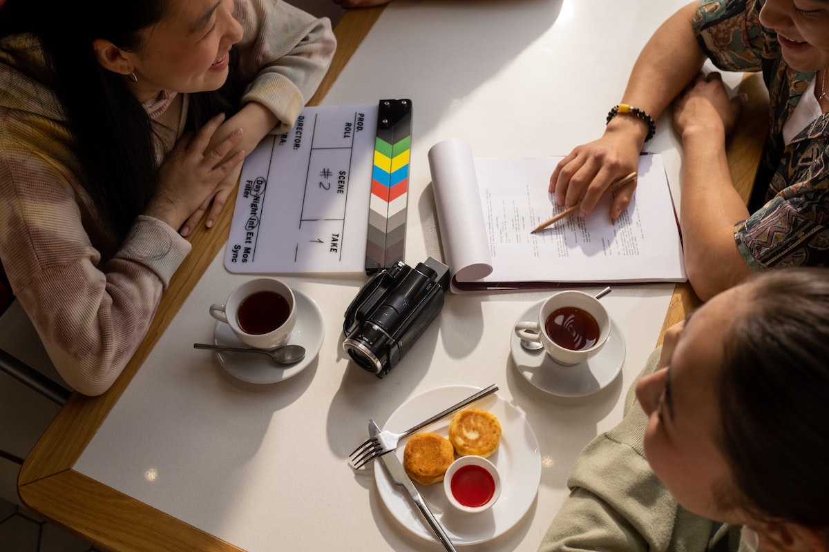 People discussing a script at a coffee shop.jpg