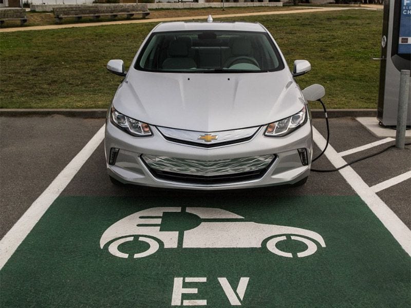 2016 Chevrolet Volt front view EV parking lot charging ・  Photo by General Motors
