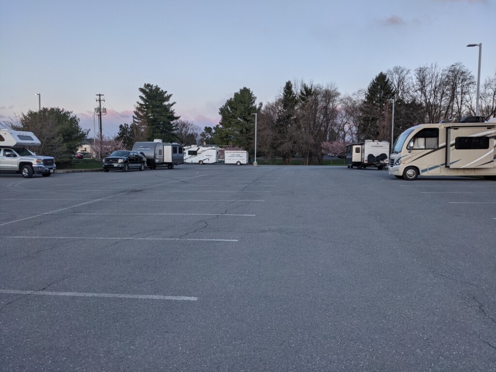 RVs are permitted to park overnight in the back lot.