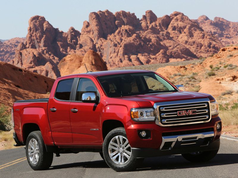 2018 GMC Canyon red in desert ・  Photo by General Motors