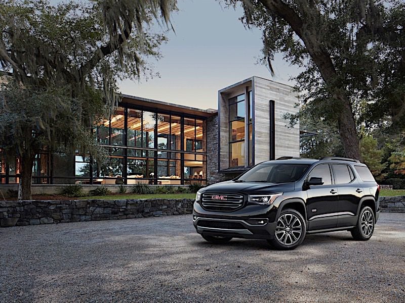 2018 GMC Acadia All Terrain three quarter in front of house ・  Photo by General Motors