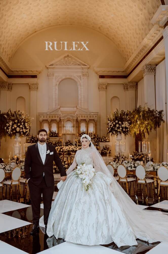 bride and groom holding hands